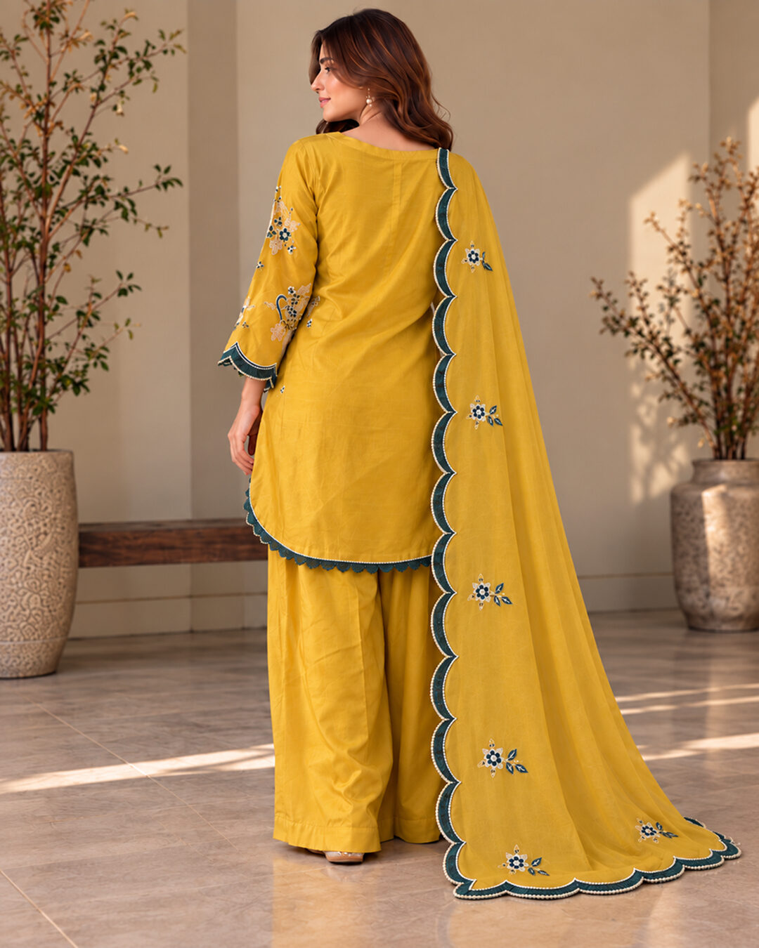 Mustard Yellow embroidered silk 3 piece suit, full-length back view with the scalloped dupatta