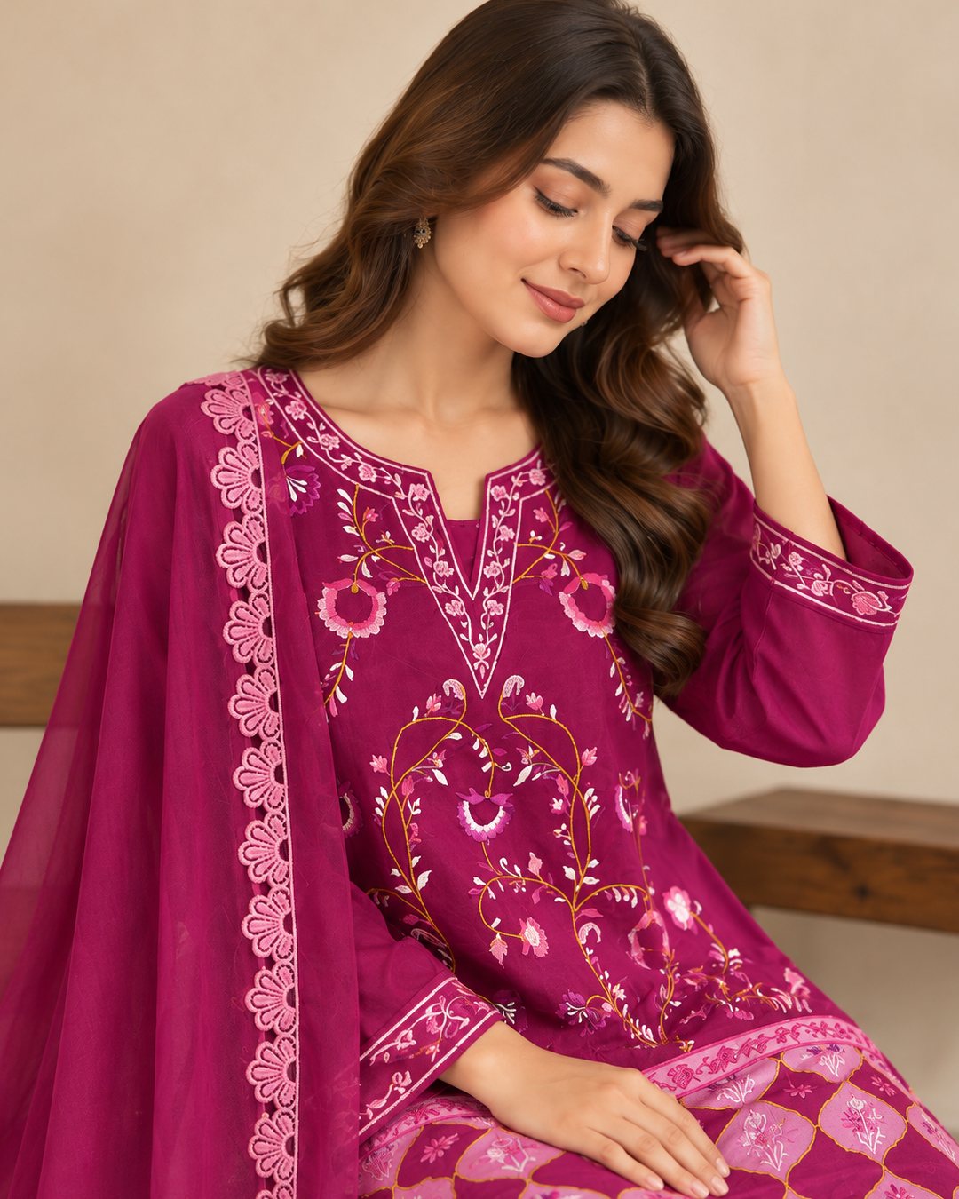 Raspberry Pink embroidered silk 3 piece suit, seated three-quarter view with the dupatta and floral embroidery
