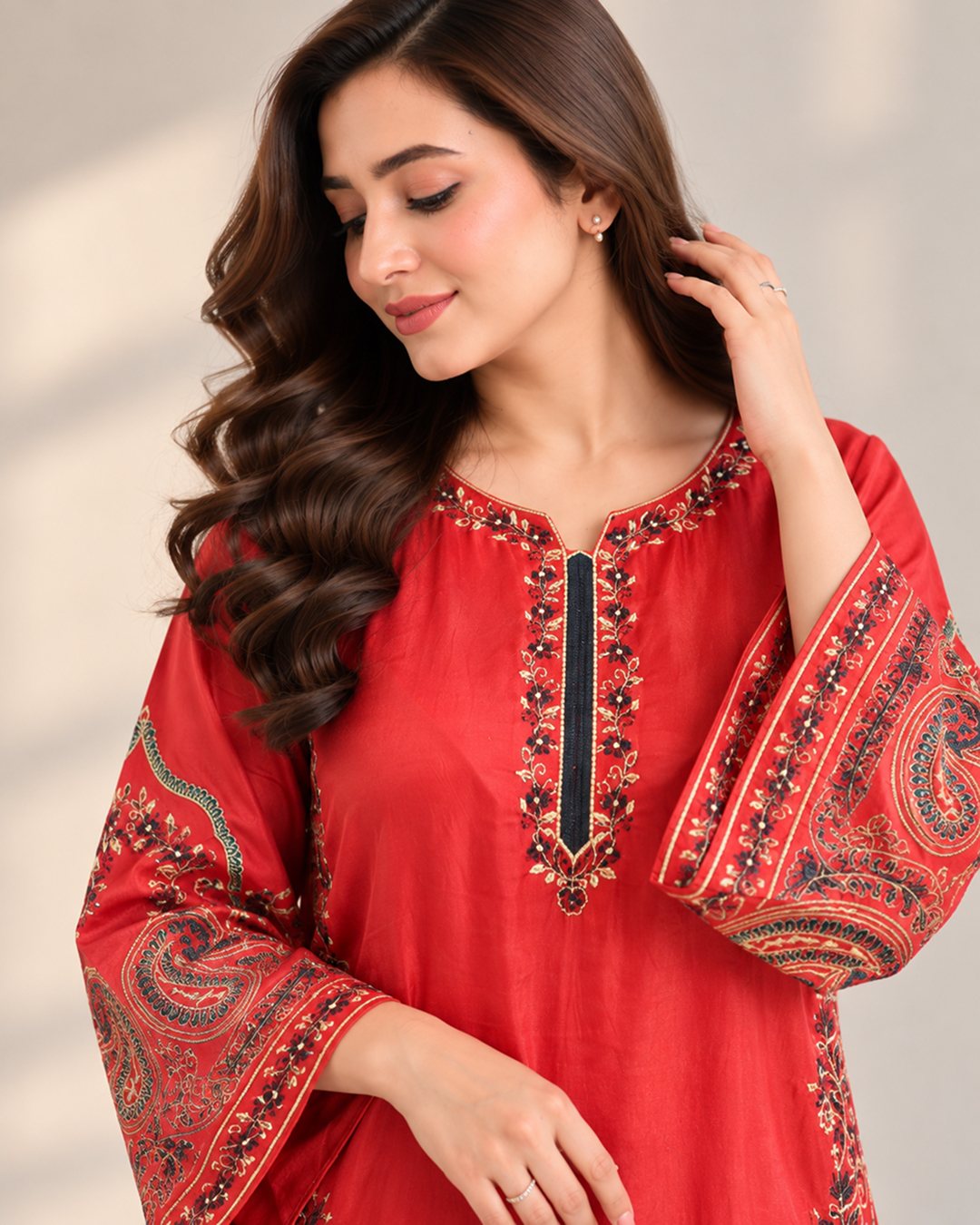 Rust Orange embroidered silk 2 piece suit, close-up of the neckline and paisley sleeve embroidery